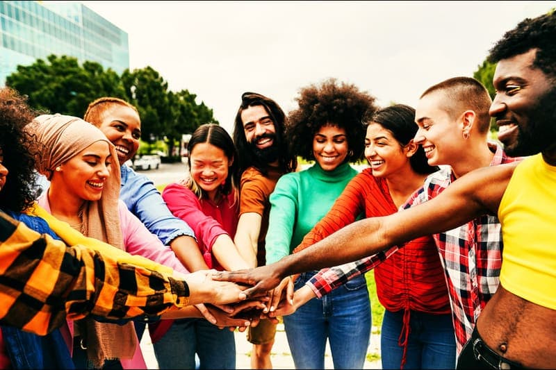 Group of members joining hands together