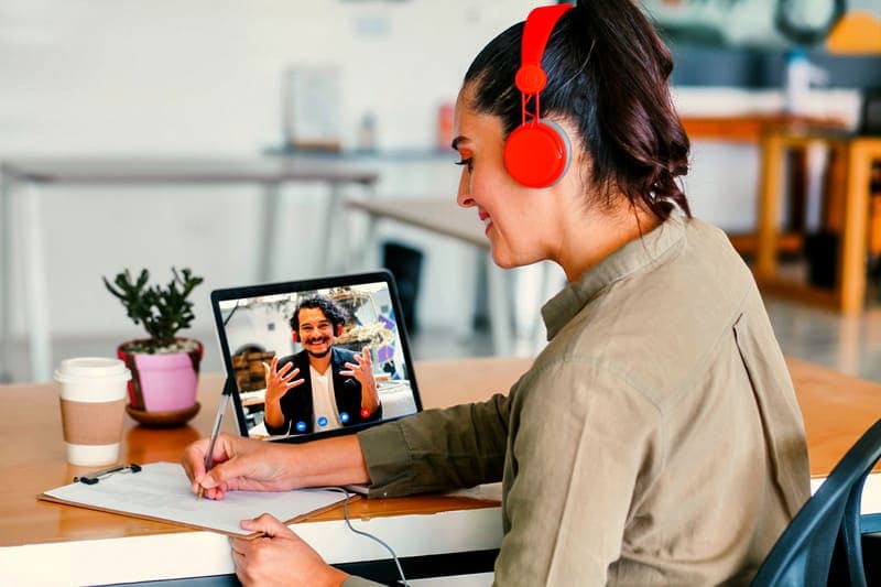 Member taking notes during an on-screen lesson
