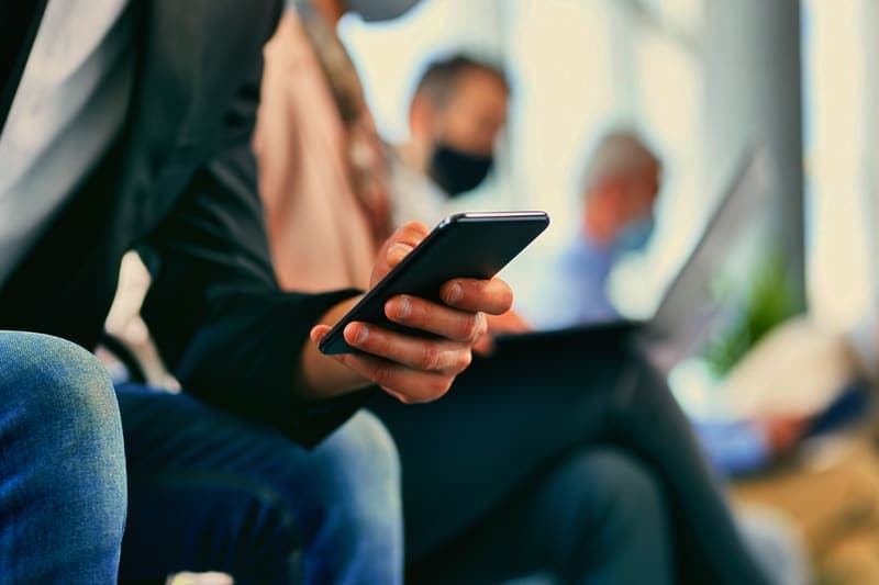 Member watching a short video on a phone